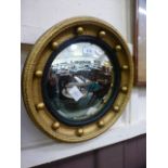 A reproduction gilt framed convex mirror