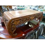 A Chinese padouk coffee table with carved vine frieze CONDITION REPORT: Fading/wear