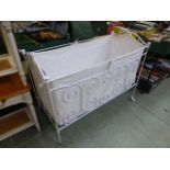 A reproduction French style metal child's cot