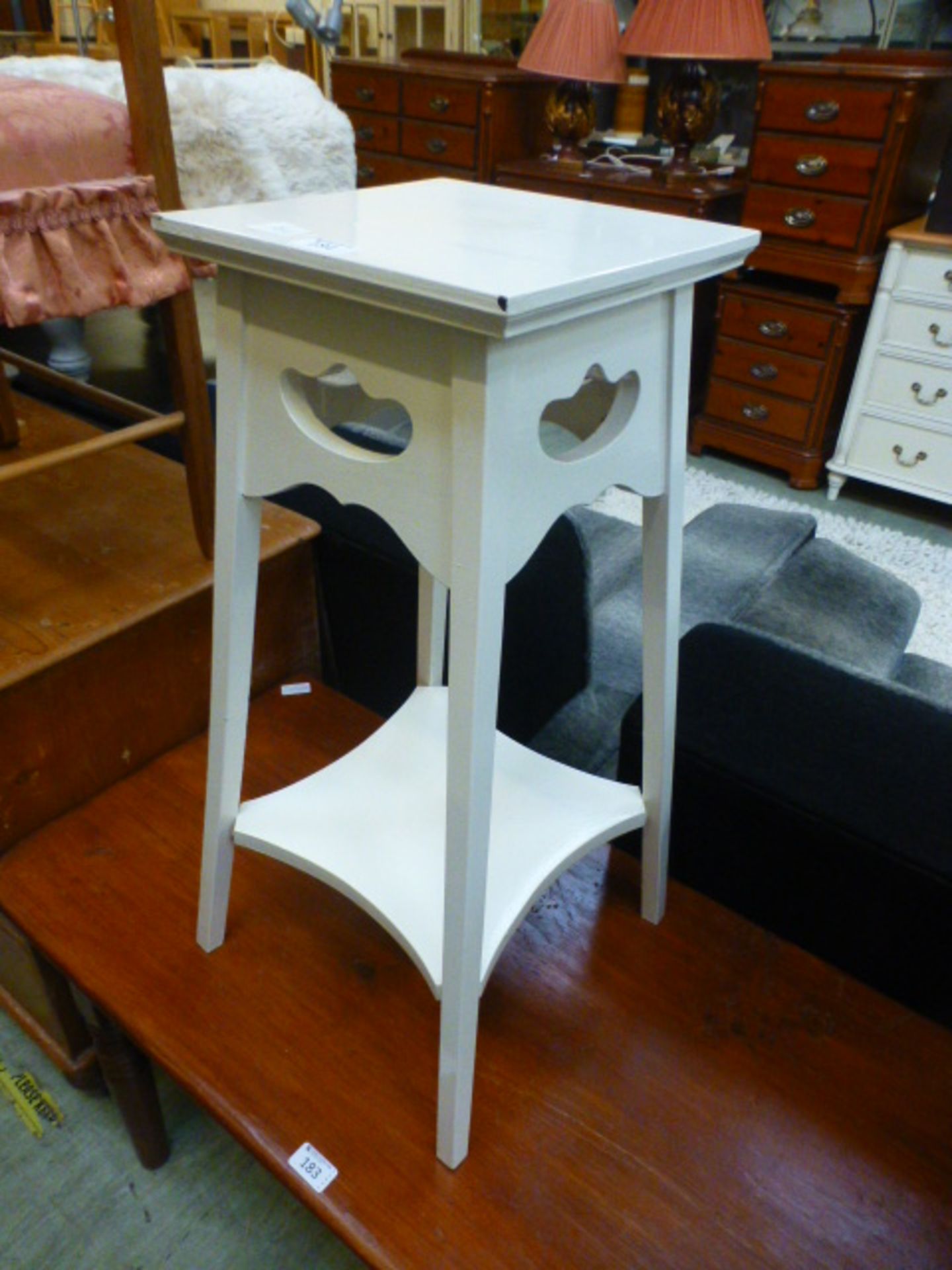 A white painted jardiniere stand