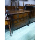 An early 20th century oak chest of two short over two long drawers