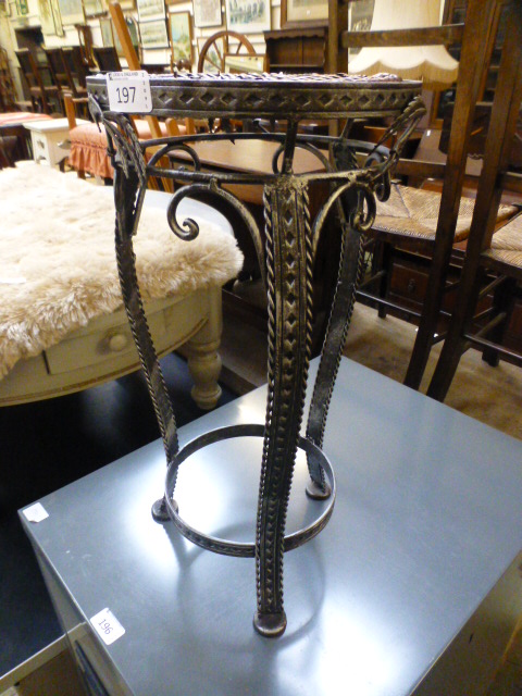 A modern metalwork plant stand