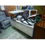 A 1980s white and chrome dressing chest having mirror to back with an assortment of six drawers