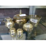 A selection of silver and white metal items to include pepper pots, salt, jug etc.