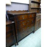 An early 20th century oak chest of two short over three long drawers