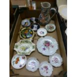 A tray of decorative trinket dishes and a water jug