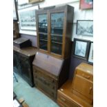 An early 20th century oak bureau bookcase,