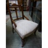 An Edwardian walnut boxwood strung and burr elm inlaid nursing chair