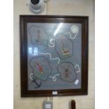 A framed and glazed needlework on a nautical theme