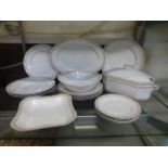 A late Victorian style part dinner set comprising of plates, bowls, tureens etc.