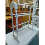 A cream painted towel rail