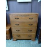An early 20th century oak chest of four long drawers