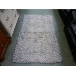 A knotted wool rug