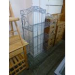 A metalwork folding set of four shelves