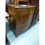 A reproduction burr walnut serpentine chest of five long drawers