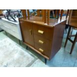 A mid-20th century design teak cabinet having three drawers with single door CONDITION