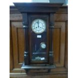 An early 20th century drop dial wall clock