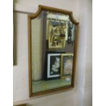 An oak framed bevel glass mirror