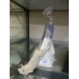 A Lladro figure of a butcher with pig
