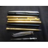 A quantity of pens and a pen knife