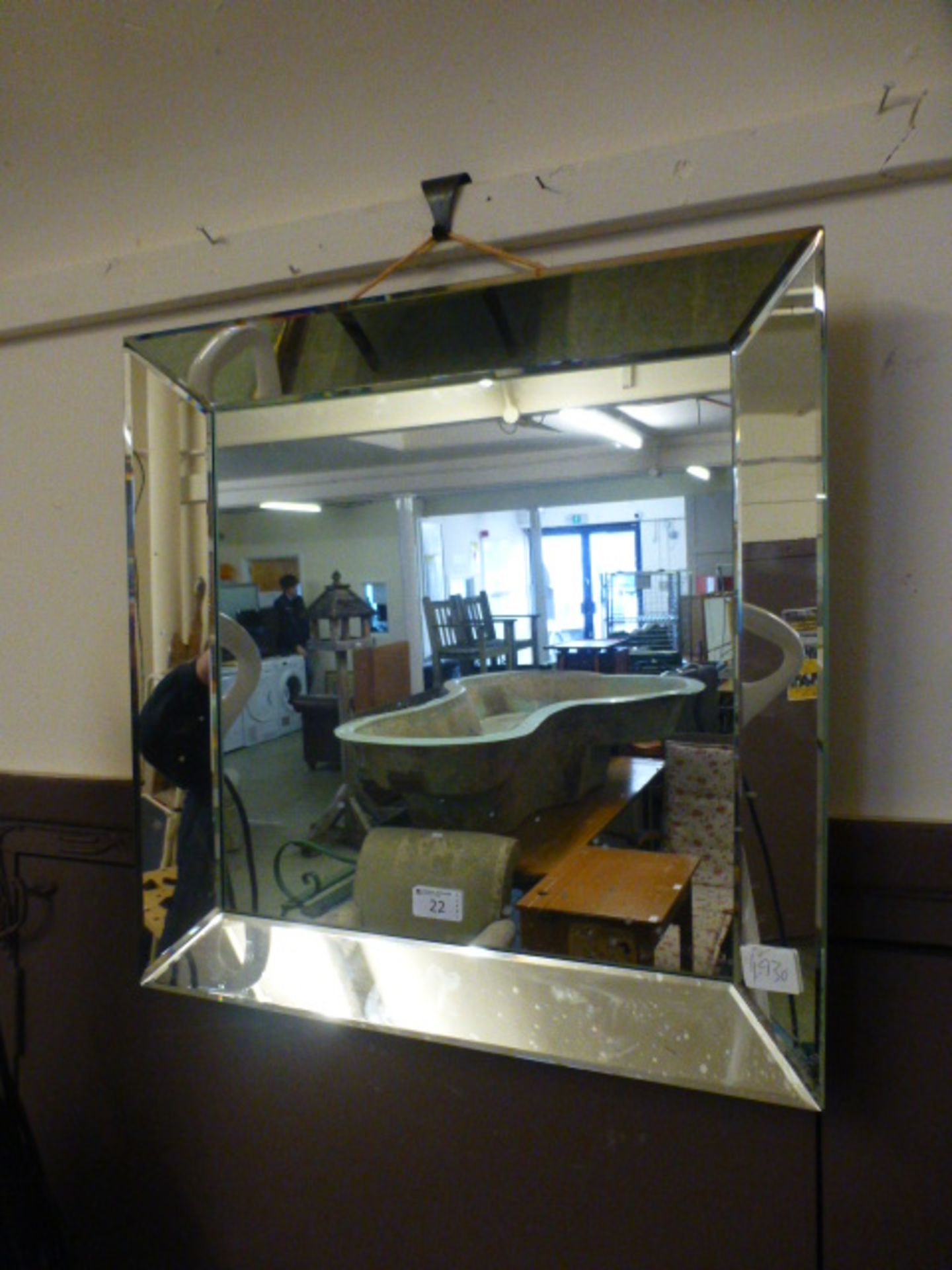 A bevelled glass edged mirror