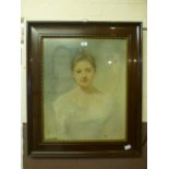 A framed and glazed pastel of young lady