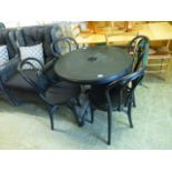 A black PVC garden table along with four matching chairs