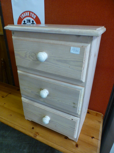 A limed pine bedside chest