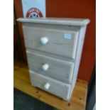 A limed pine bedside chest