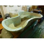 A substantial fibreglass pond liner