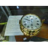 A reproduction brass ships clock by Bells of Liverpool