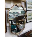 A modern ornate framed mirror