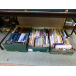 Three trays of hardback and other books on various subjects