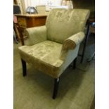 A Parker Knoll armchair upholstered in a floral gold fabric