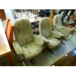 Three green upholstered swivel chairs with one stool