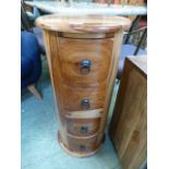 An eastern hardwood circular four drawer chest of drawers