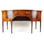 An early 19th century mahogany and boxwood strung bow front sideboard,