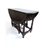 A late 17th century and later oak gate leg table,