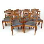 A set of ten (8+2) early 19th century mahogany dining chairs upholstered in a gold patterned blue