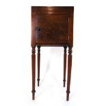 An 18th century mahogany pot cupboard, the galleried top over single door on turned legs, h. 80.