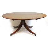 An 18th century style mahogany and satinwood banded dining/centre table,