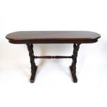 A 19th century mahogany side table, the 18th century oval top on turned end supports and stretcher,