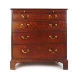 A mid 18th century oak chest of four long drawers,