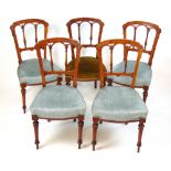 A set of five late Victorian walnut, amboyna, boxwood strung and marquetry dining chairs, h.