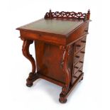 A Victorian walnut davenport,