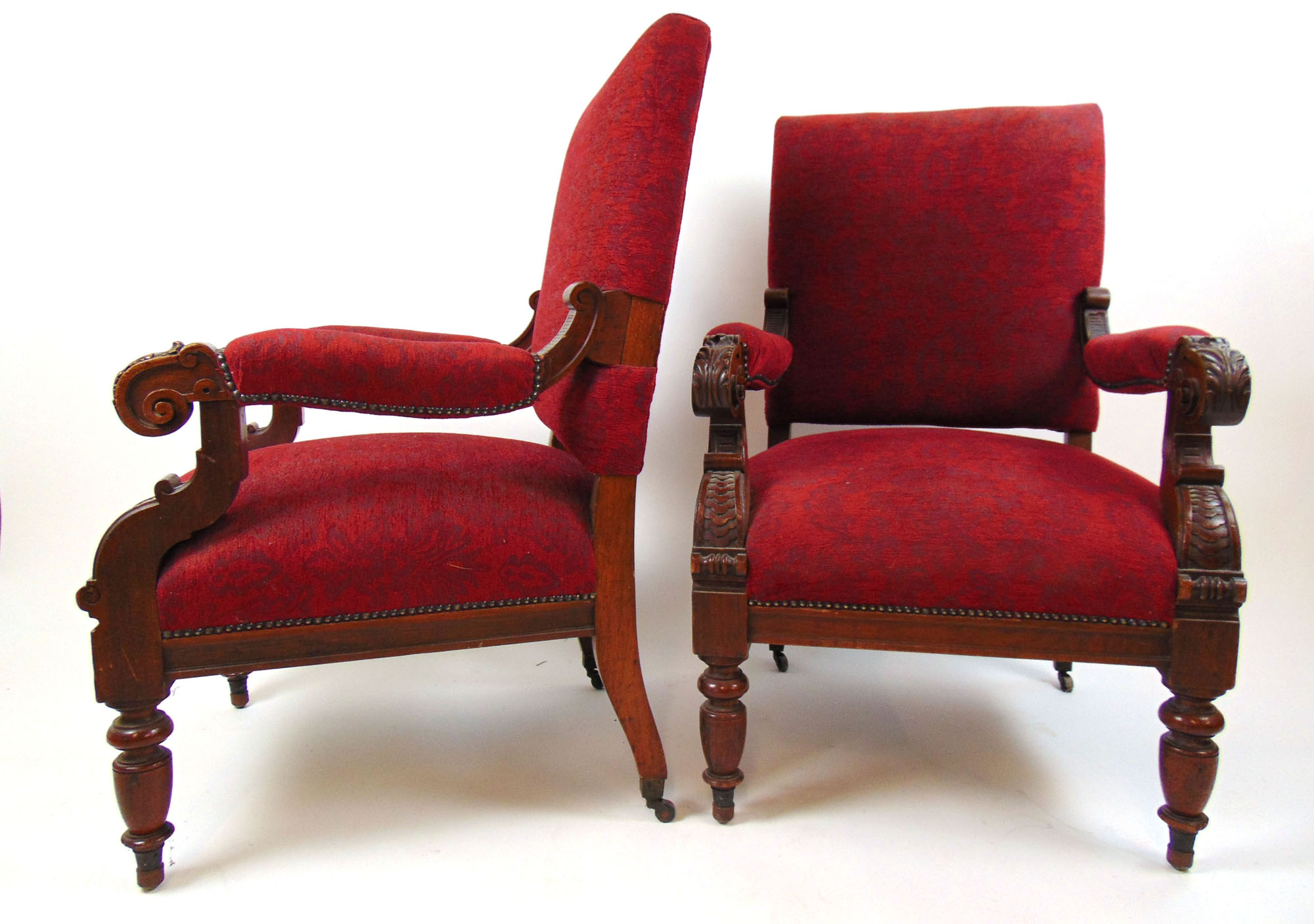 A pair of Victorian walnut open arm chairs upholstered in a floral patterned red fabric, - Image 2 of 2