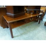 A modern mahogany effect rectangular coffee table with single drawer