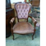 A reproduction spoon back open armchair CONDITION REPORT: No apparent issues