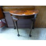 A mid-20th century flame mahogany demi-lune hall table CONDITION REPORT: No