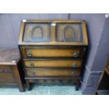 A reproduction oak bureau,